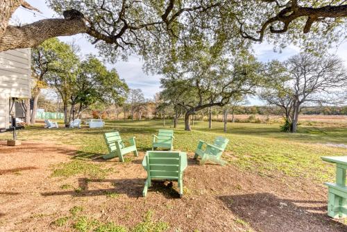 a group of green chairs in a park at Tiny Islands Resort in Blanco