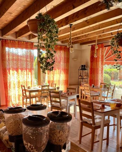 a dining room with wooden tables and chairs at Country Home B&B Il Melo in Vicenza