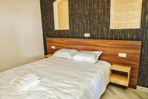 Cama o camas de una habitación en Palmiers Hôtel Club