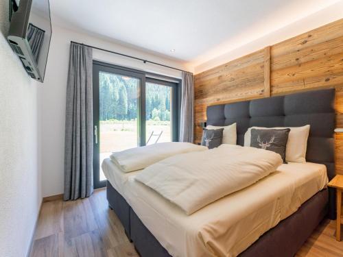 Giường trong phòng chung tại Tauernlodge Amadeiro Im Pongau