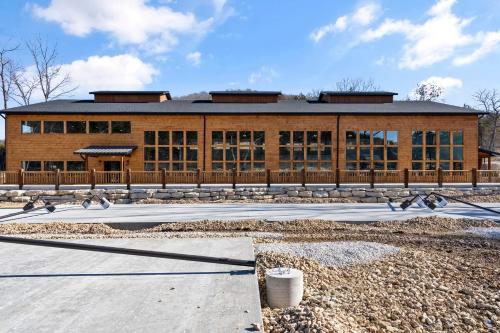 a large building with birds in front of it at Multiple Arcades-Private Hot Tub-Cmty Indoor Pool-Free Daily Tickets-Water View-Cmty Dog Park in Hollister