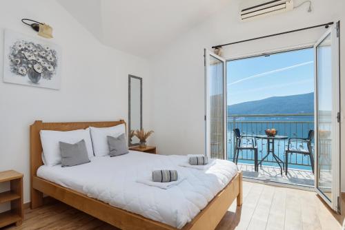 Postel nebo postele na pokoji v ubytování Rosic Apartments Baosici