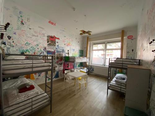 Ένα ή περισσότερα κρεβάτια σε δωμάτιο στο Kiez Hostel Berlin