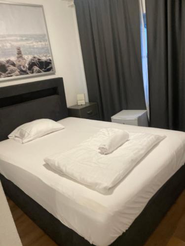 Katil atau katil-katil dalam bilik di Lindis Hotel