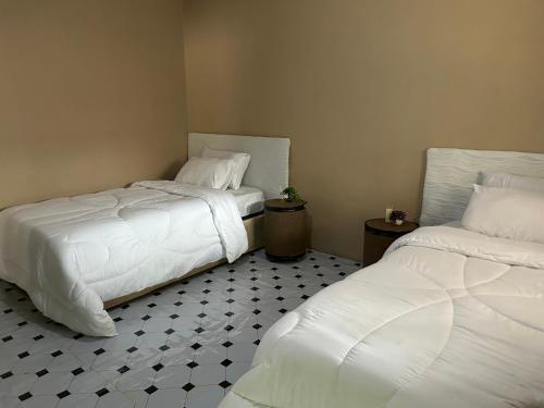 Un pat sau paturi într-o cameră la Cozy chalala