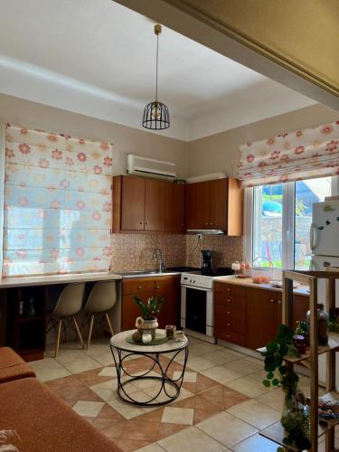 a kitchen with a couch and a table in a room at Evita Studios in Xiropigado