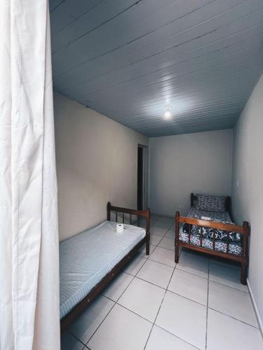 Ένα ή περισσότερα κρεβάτια σε δωμάτιο στο Hotel e pousada JRM