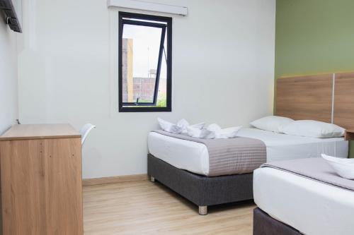 Postel nebo postele na pokoji v ubytování Zentra Hotel