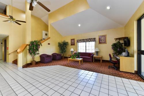 a lobby with purple chairs and a waiting room at America's Best Value Inn & Suites, Atlanta - Morrow in Morrow