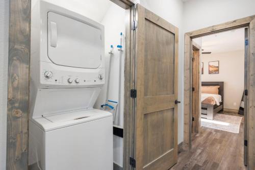 a laundry room with a washer and dryer at All New Cabin w Free Attraction Tickets-Pvt Hot Tub-Community Indoor Pool in Hollister