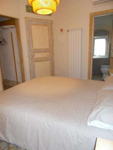 Ένα ή περισσότερα κρεβάτια σε δωμάτιο στο Guest House Le Arti Minori