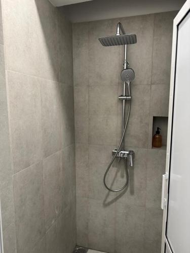 a shower with a shower head in a bathroom at CityRest Fort in Colombo