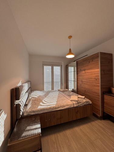 Postel nebo postele na pokoji v ubytování DL Apartment