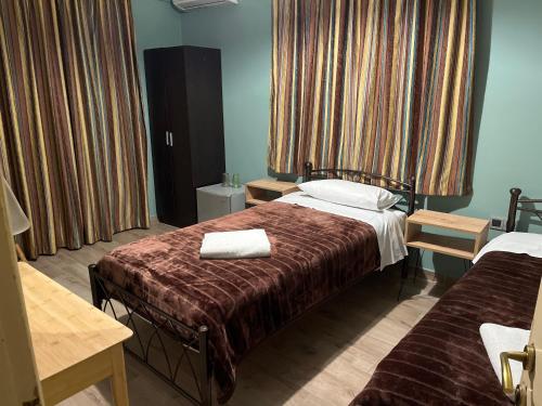 A bed or beds in a room at Artemis