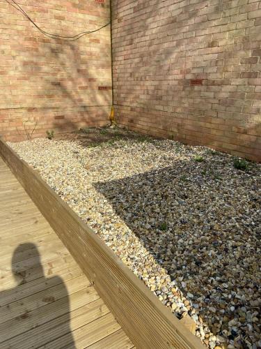 a shadow of a person standing next to a brick wall at Winter double bedroom in Stone Grove