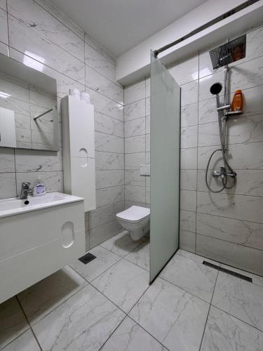 Koupelna v ubytování DL Apartment