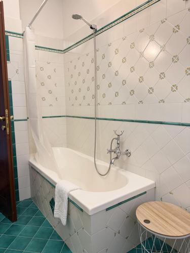 a bathroom with a bath tub and a sink at Casa vacanze - I due ulivi- passignano sul Trasimeno in Passignano sul Trasimeno