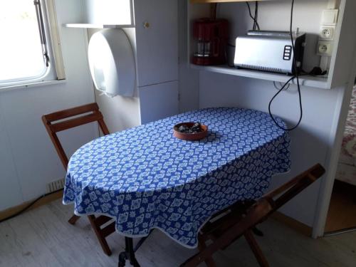 a table with a bowl of food on top of it at Bungalow à la campagne in Senonches