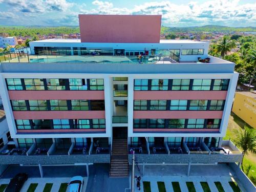 an aerial view of a building with a swimming pool at Villas do Porto Residence by La Playa in Porto De Galinhas