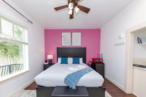 a bedroom with a bed and a ceiling fan at 30-A Inn & Suites in Santa Rosa Beach