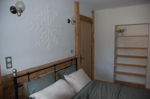Postel nebo postele na pokoji v ubytování Gite les 4 Saisons - chambre Hiver