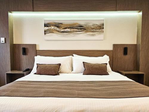 Postel nebo postele na pokoji v ubytování Hotel Le Voyageur