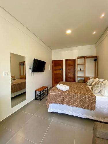 Ένα ή περισσότερα κρεβάτια σε δωμάτιο στο Residencial Mirante