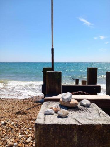 a group of rocks on a table on the beach at Regis Lodge Guest House in Bognor Regis