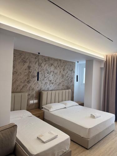 Un ou plusieurs lits dans un hébergement de l'établissement Moonlight Hotel