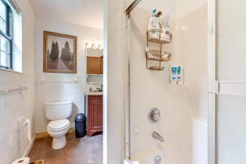 a bathroom with a toilet and a shower at Deck and Boat Dock Lakefront Getaway in Camdenton in Camdenton
