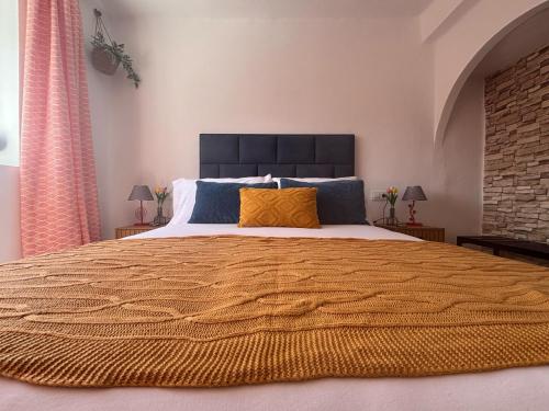 En eller flere senge i et værelse på Apartamento Anita Ronda