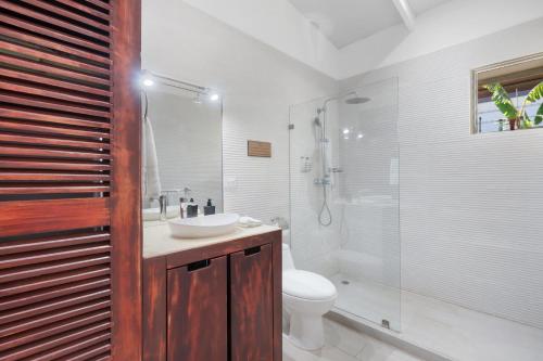 a bathroom with a sink and a toilet and a shower at 3-BD Home with Pool Near Beach in Brasilito
