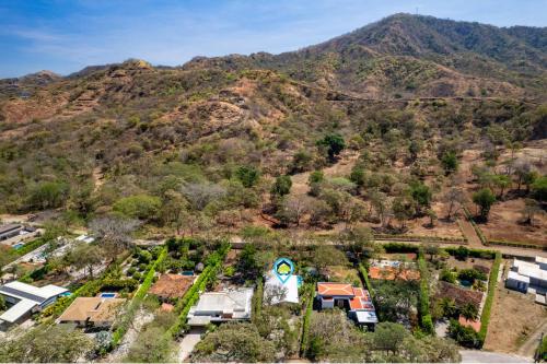 an aerial view of a house with a mountain in the background at 3-BD Home with Pool Near Beach in Brasilito