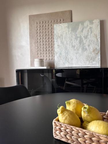 a basket of pears sitting on top of a table at Par71 - Marco Simone golf club Rome in Marco Simone