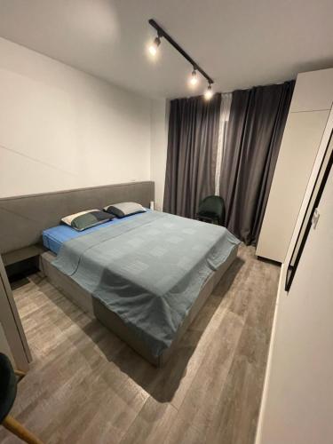 Un pat sau paturi într-o cameră la Parcului20 Apart near Romexpo, Herastrau Park