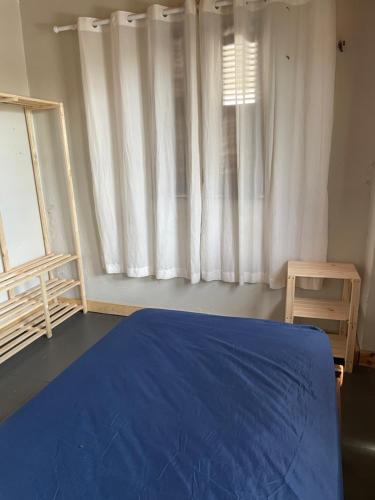 Ένα ή περισσότερα κρεβάτια σε δωμάτιο στο Casa Aconchego