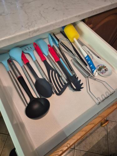 a drawer with many different utensils on it at Bella Hiša in Sromlje