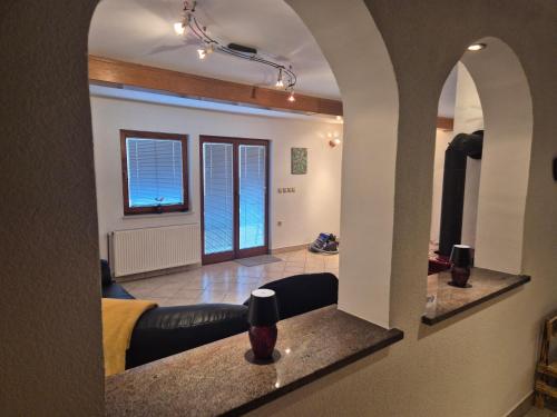 a living room with a couch and a window at Bella Hiša in Sromlje
