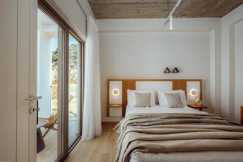 Ένα ή περισσότερα κρεβάτια σε δωμάτιο στο Ethereal White Villas