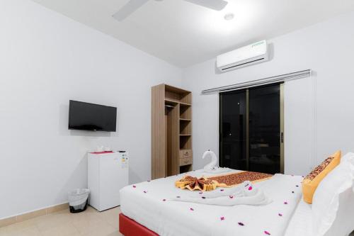 a bedroom with a bed with a pair of shoes on it at Old town apartment 2 in Aqaba