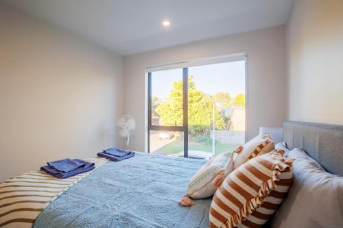 Ένα ή περισσότερα κρεβάτια σε δωμάτιο στο Zen Style 3 bedrooms near School, shop and Eateries