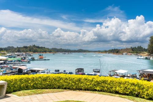 a view of a harbor with boats in the water at Hotel Casa Verde Guatapé in Guatapé