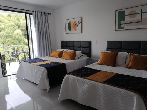 Postel nebo postele na pokoji v ubytování Apartamento Campestre Pereira