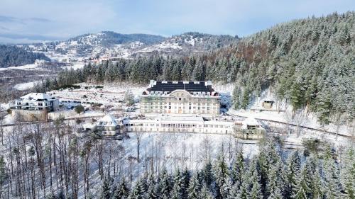 an aerial view of a building in the snow at Domaine de Haslach, The Originals Collection, Résidence de Tourisme in Munster