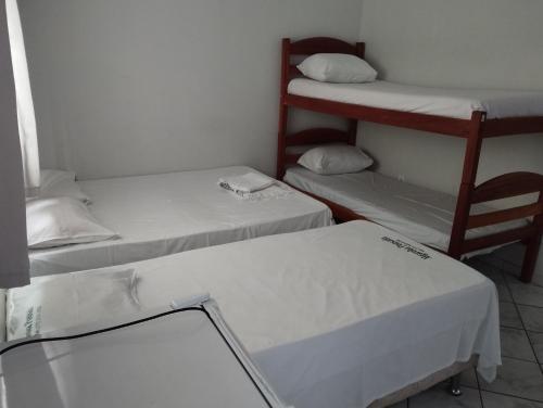 Postel nebo postele na pokoji v ubytování Hotel Algaroba Anexo