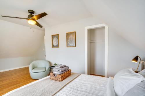 a bedroom with a bed and a chair at Steps to Lake Michigan Manitowoc Home with Fire Pit in Manitowoc