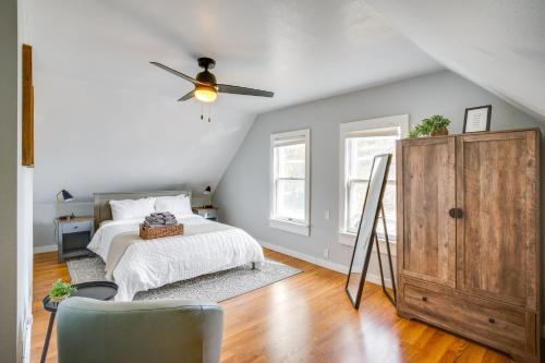 a bedroom with a bed and a ceiling fan at Steps to Lake Michigan Manitowoc Home with Fire Pit in Manitowoc