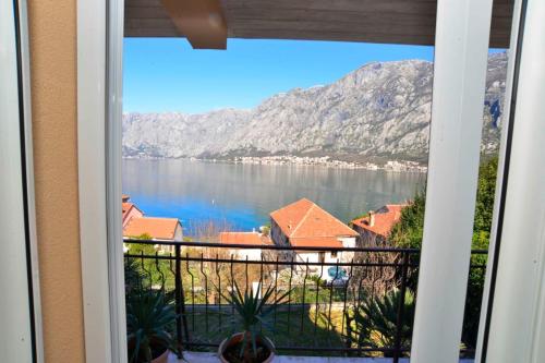 a view of a lake from a window at Apartments Boka bay in Kotor