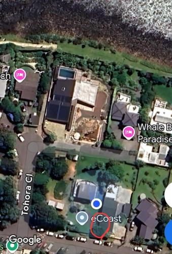 an aerial view of a house with a map at The Dream Whale Bay in Raglan