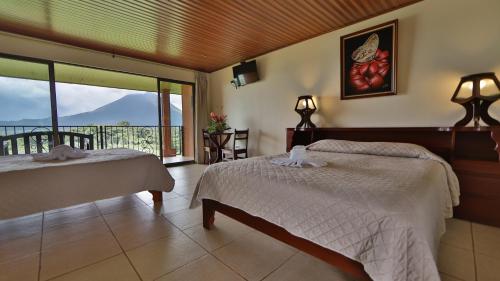 Ένα ή περισσότερα κρεβάτια σε δωμάτιο στο Hotel Linda Vista